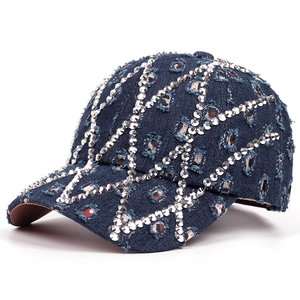 Distressed blue denim baseball cap with rhinestone lattice pattern and ripped details