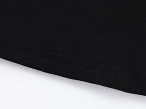 Close-up of double-stitched hem on black modal slim fit athletic t-shirt for women