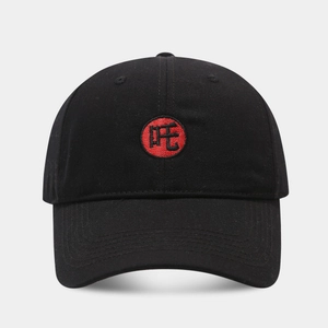 Close-up of red circular embroidery with Zha character on a black cotton baseball cap