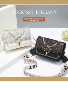 Detail of elegant small flap bags with heart-shaped locks and glitter finish texture