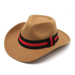 Close-up of a camel felt cowboy hat featuring a distinctive black and red striped band detail