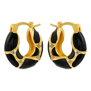 Detailed macro view of gold irregular lava hoop earrings with black enamel and zircons
