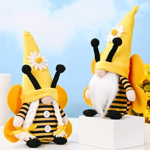 Pair of bee-themed gnome plush toys with yellow daisy hats and striped bodies