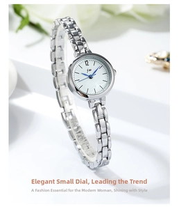 Detail of minimalist silver women's watch with steel chain strap and white dial