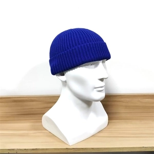 Unisex blue knitted skullcap beanie hat for winter hip hop style on model head