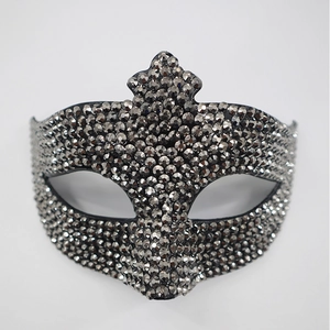 Detail of dark grey rhinestones on a black masquerade half-face party mask
