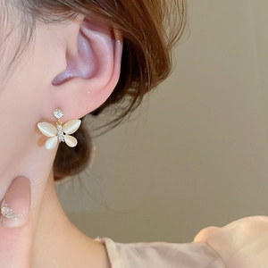 Elegant gold butterfly stud earrings with cat eye stone wings and sparkling zircons