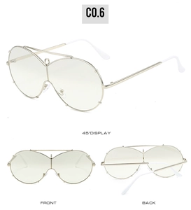 Three-angle views of oversized golden rimless sunglasses with unique metal frame bridge