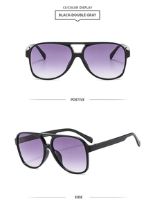 Classic aviator sunglasses with black double-bridge frame and purple gradient lenses