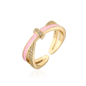 Close-up of cross design ring with pink enamel drip oil and white zircon stones