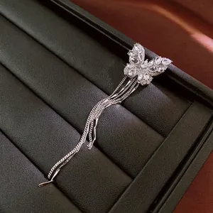 Sparkling zircon butterfly tassel ear clips with silver finish and crystal fringe