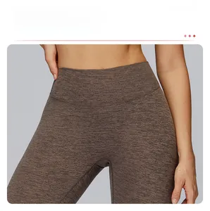 Detail of high waist yoga leggings showing the seamless front design and brushed texture