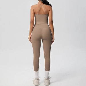 Close-up of cross-back yoga set featuring high-waist leggings and sports bra in mocha brown