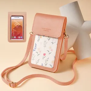 Pink floral touchscreen phone bag with adjustable strap and transparent back window
