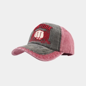 Detail of vintage washed cotton baseball cap with 3D embroidery and distressed finish