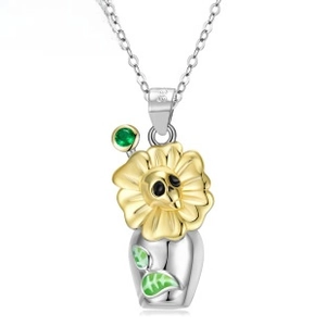 Macro view of S925 silver skull sunflower pendant with green gemstones and enamel leaves