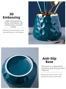 Close-up of deep teal ceramic storage jar with 3D embossed texture and gold rim