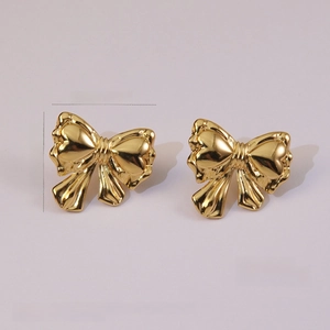 Macro detail of 18K gold plated stainless steel bow earrings with measurements