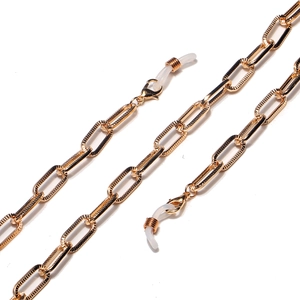 Close-up of golden hollow rectangular links with anti-slip silicone connectors for eyewear