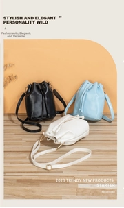 Three drawstring bucket bags in black, light blue, and white with adjustable straps