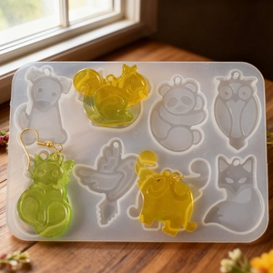 Silicone mold for animal shaped resin earrings featuring panda elephant and owl designs