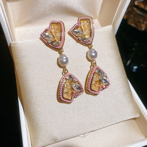 Vintage heart fringe earrings with pink rhinestones and pearls in a jewelry box