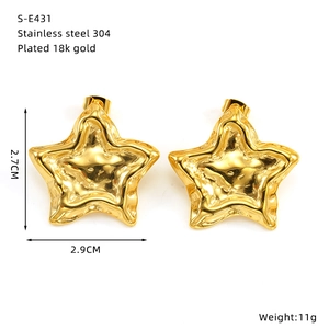 Detail view of 18k gold plated stainless steel star earrings with texture and dimensions