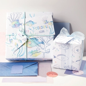 Blue ocean themed gift wrapping set with gift boxes, paper, ribbons and cards
