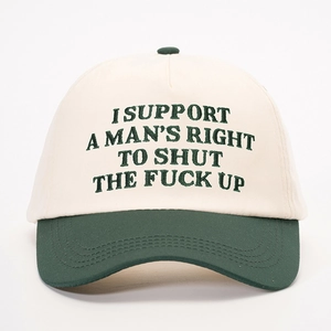 Classic two-tone baseball cap in beige and dark green with bold slogan embroidery