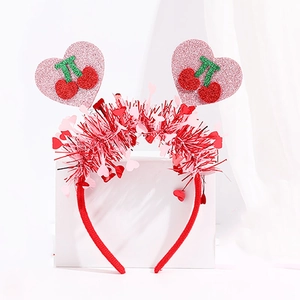 Detail of red Valentine's headband with glittery pink hearts and cherry patterns