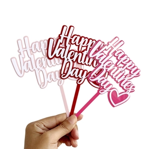 Three-piece acrylic Happy Valentine's Day cake toppers in pink and red colors