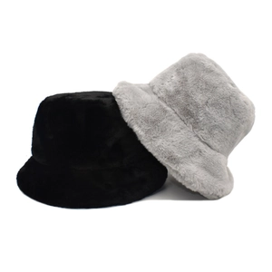 Plush faux fur bucket hats in black and light grey for winter warmth and fashion