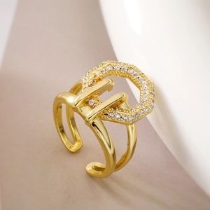 Macro detail of 18K gold plated double band ring with sparkling zircon geometric elements