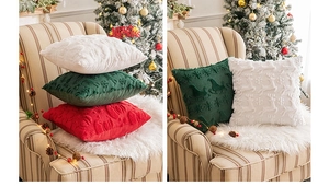 Detail of plush Christmas pillow covers with 3D embroidered reindeer and snowflake patterns