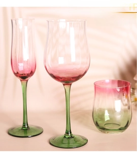 Detailed close-up of tulip-shaped wine glasses with pink gradient and hammer texture