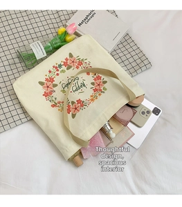 Interior view showing large capacity space in canvas tote bag with floral print