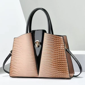 Minimalist multi-textured tote bag with crocodile pattern and metal spherical lock