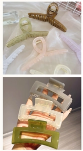 Detail of twisted and rectangular hair claw clips in assorted glossy candy colors