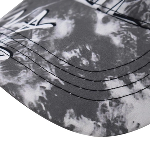 Baseball cap with black and white tie-dye pattern and parallel stitching detail
