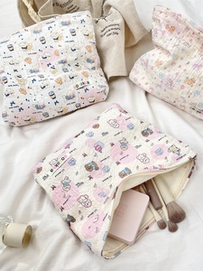 Quilted cotton makeup bag with cute cartoon patterns and top zipper closure for travel