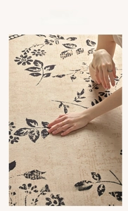 Detailed texture of artistic floral beige carpet with soft tufted leaf pattern