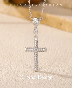 Macro view of S925 sterling silver cross pendant with shimmering cubic zirconia stones
