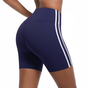 Detail of high-waisted navy blue cycling shorts with white side stripes and lifting effect