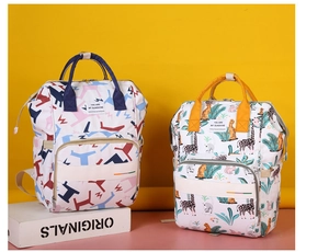 Close-up of stylish printed mommy backpacks in geometric and giraffe patterns