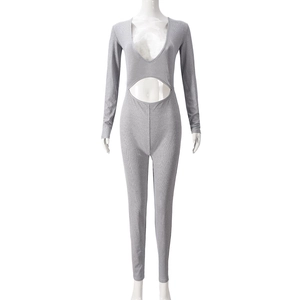 Detailed view of grey long sleeve bodysuit featuring hollow out design and ribbed fabric