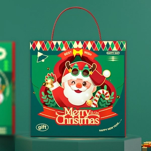 Festive red Christmas gift bag with cartoon Santa Claus and green handle display