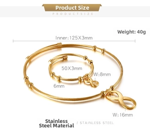 Macro shot of gold stainless steel infinity choker and bracelet set with twisted texture