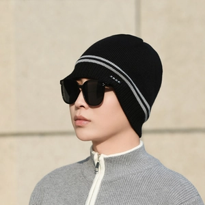 Winter knitted beanie in black with grey stripes and warm fleece lining for outdoor skiing