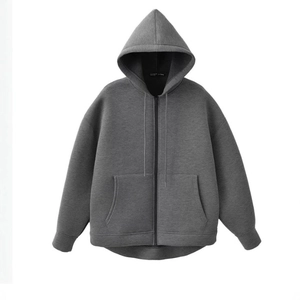 Front view of loose fit dark grey zip-up hoodie with hood and kangaroo pockets