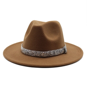 Detailed texture of brown wool fedora hat featuring a sparkling crystal rhinestone band